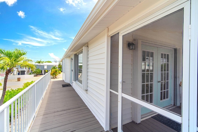 22988 Port Royal Ln, Cudjoe, FL 33042 - wooden deck featuring french doors