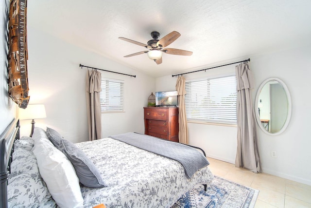 22988 Port Royal Ln, Cudjoe, FL 33042 - bedroom with multiple windows, lofted ceiling, light tile patterned floors, and a ceiling fan