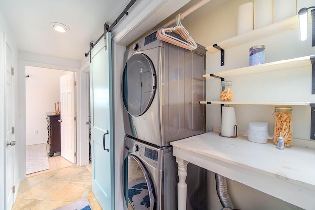22988 Port Royal Ln, Cudjoe, FL 33042 - washroom featuring estacked washer and dryer, a barn door, and recessed lighting