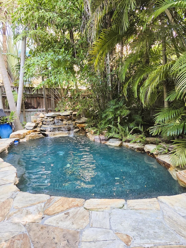 view of pool featuring pool water feature