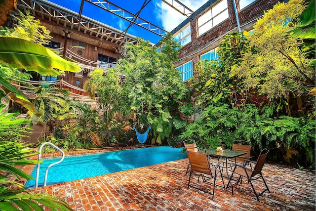 view of swimming pool with a patio area