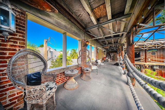 view of patio / terrace featuring a lanai