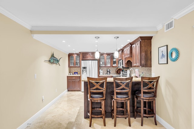 87465 Old Hwy Unit 106, Islamorada, FL 33036 - indoor wet bar featuring stainless steel appliances, tasteful backsplash, pendant lighting, ornamental molding, and recessed lighting