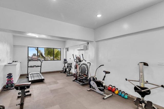 87465 Old Hwy Unit 106, Islamorada, FL 33036 - exercise area with recessed lighting, a wall mounted air conditioner, and a textured ceiling