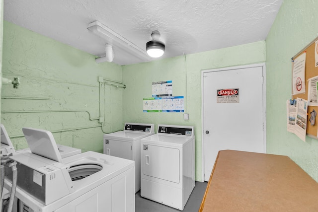 87465 Old Hwy Unit 106, Islamorada, FL 33036 - shared laundry featuring separate washer and dryer, a textured wall, and a textured ceiling