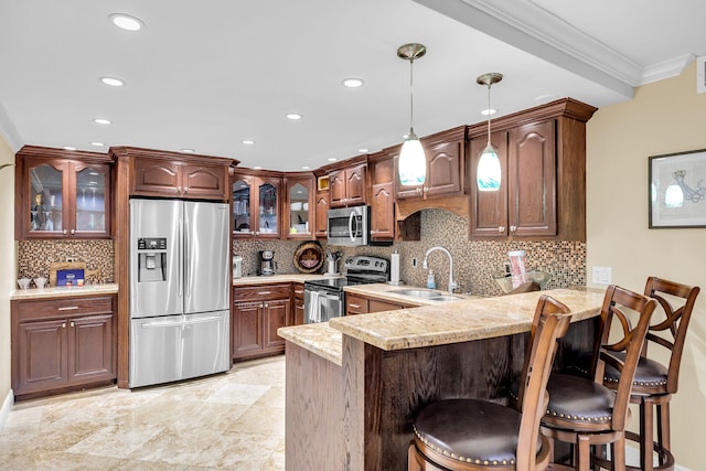 87465 Old Hwy Unit 106, Islamorada, FL 33036 - kitchen with appliances with stainless steel finishes, crown molding, a peninsula, light countertops, and decorative backsplash
