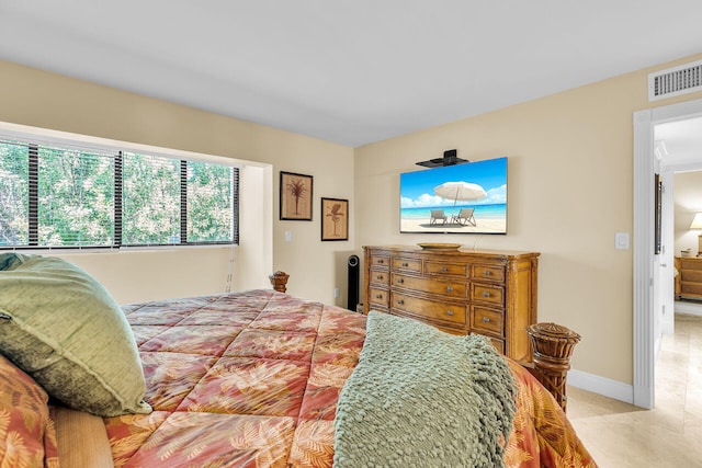 87465 Old Hwy Unit 106, Islamorada, FL 33036 - bedroom featuring baseboards and light tile patterned floors
