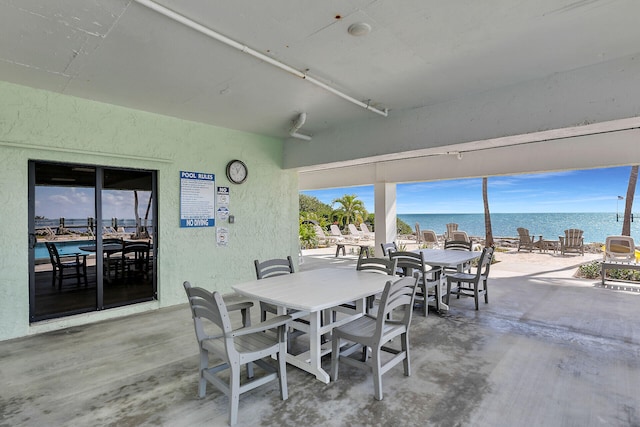 87465 Old Hwy Unit 106, Islamorada, FL 33036 - view of patio with a water view and outdoor dining space