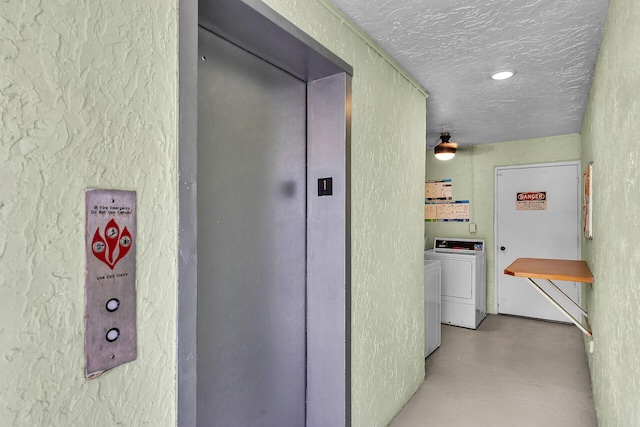 87465 Old Hwy Unit 106, Islamorada, FL 33036 - hallway with a textured wall, finished concrete floors, a textured ceiling, and separate washer and dryer