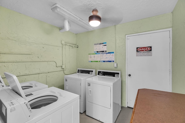 87465 Old Hwy Unit 106, Islamorada, FL 33036 - community laundry with washer and clothes dryer and a textured wall