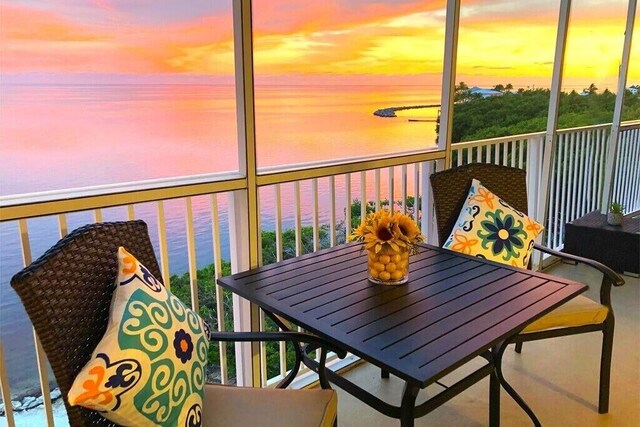 balcony at dusk with a water view