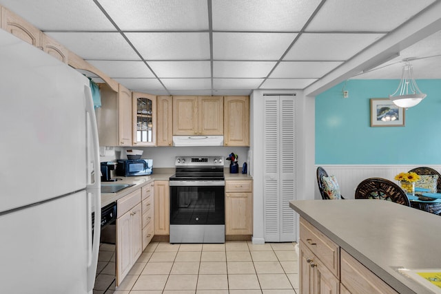 kitchen with stainless steel range with electric stovetop, decorative light fixtures, light brown cabinets, black dishwasher, and white fridge