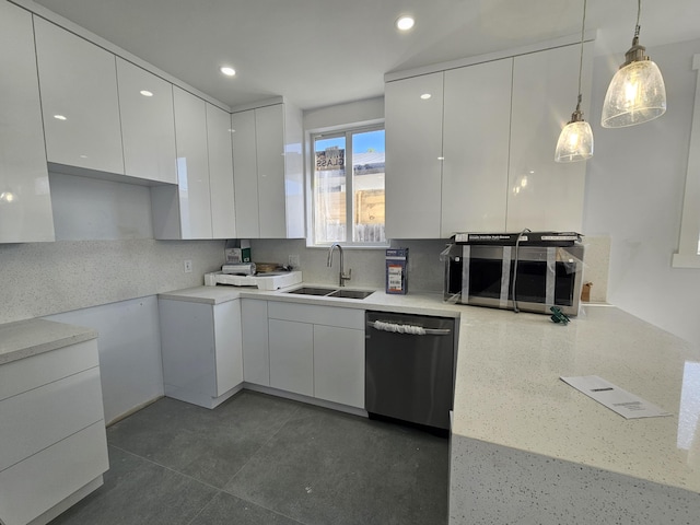 kitchen with white cabinets, dishwashing machine, modern cabinets, hanging light fixtures, and a sink