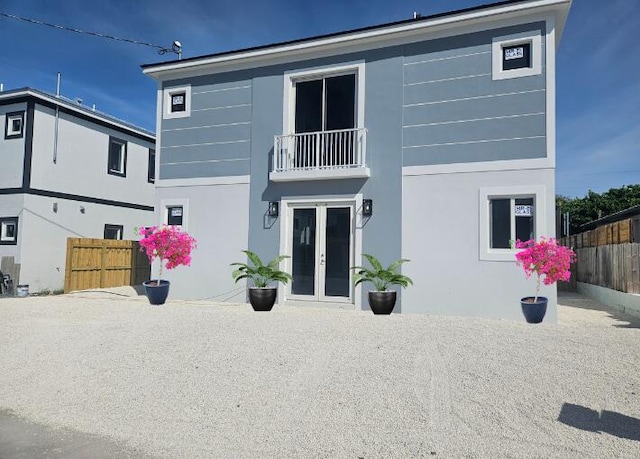 7 Orange Dr, Key Largo, FL 33037 - back of property featuring french doors, a balcony, and stucco siding