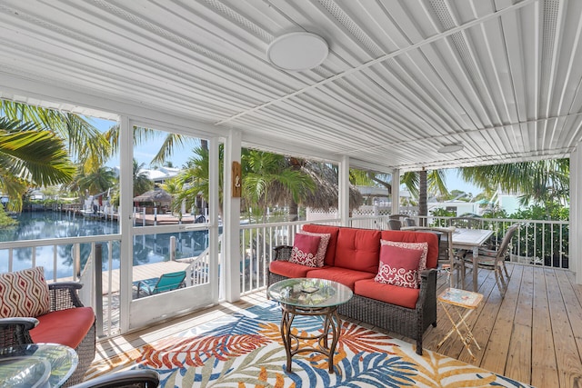 sunroom with a water view