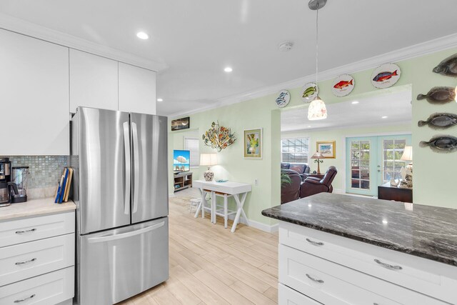 285 Blackbeard Rd, Little Torch, FL 33042 - kitchen featuring pendant lighting, stainless steel fridge, crown molding, and white cabinets