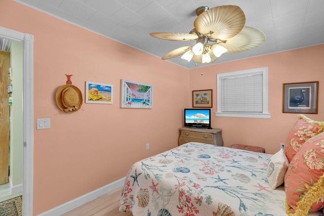 bedroom featuring light hardwood / wood-style flooring and ceiling fan