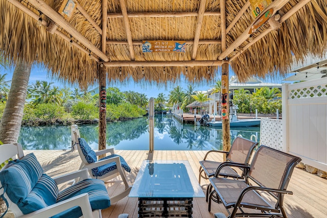 view of dock featuring a gazebo and a water view