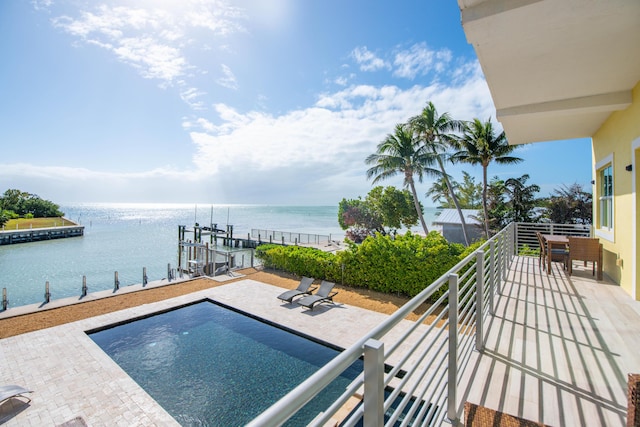 view of pool with a water view