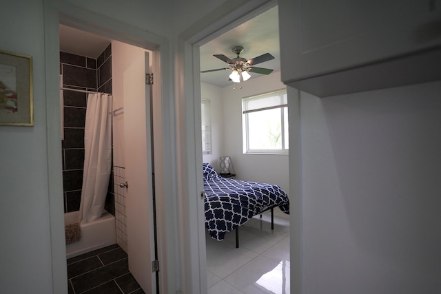 tiled bedroom with ceiling fan