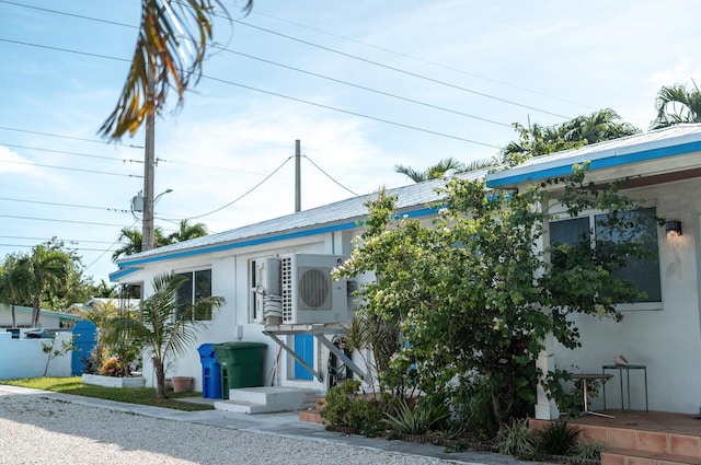 view of building exterior featuring ac unit