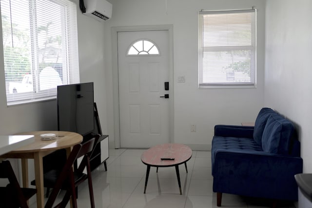 foyer with a wall mounted air conditioner and light tile patterned floors