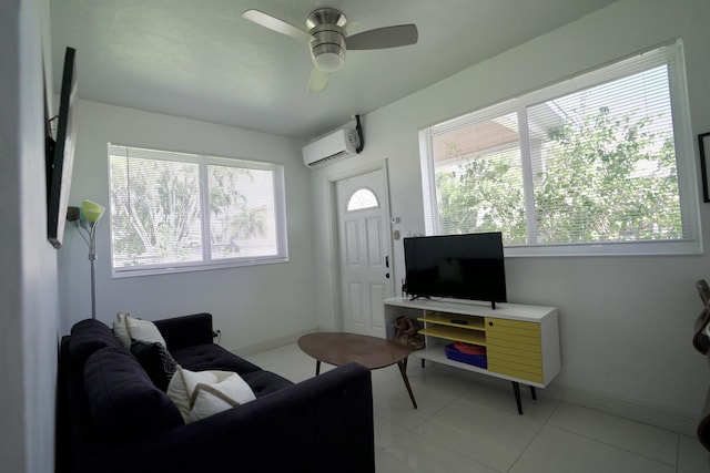 living room with ceiling fan, a wall unit AC, and light tile patterned floors