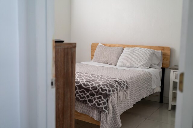 bedroom featuring tile patterned floors