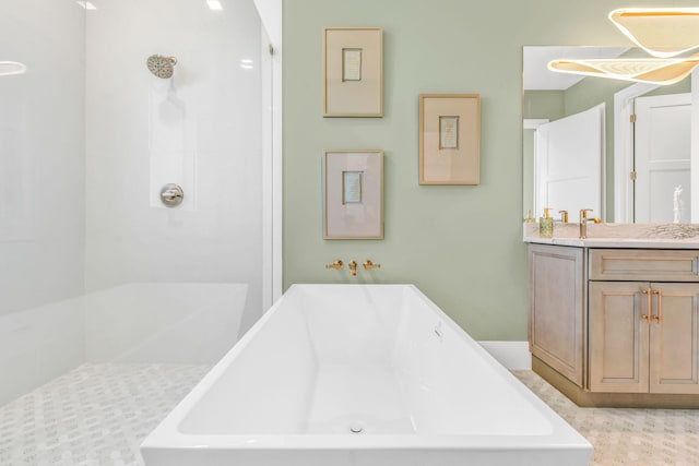 bathroom featuring vanity and independent shower and bath