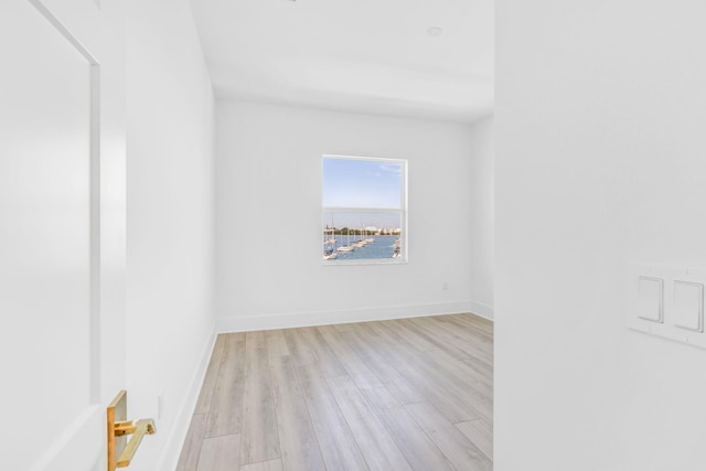 unfurnished room featuring light hardwood / wood-style floors