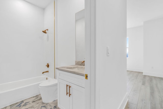 full bathroom featuring shower / bath combination, vanity, hardwood / wood-style flooring, and toilet