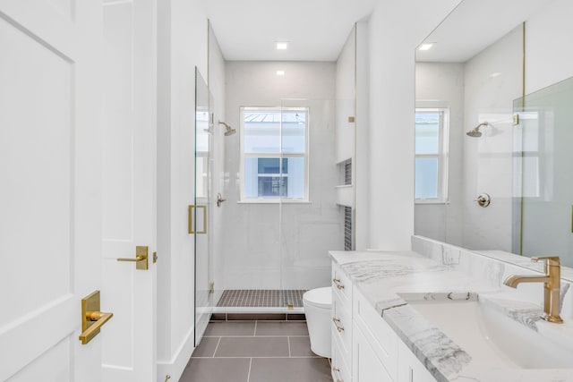 bathroom featuring vanity, an enclosed shower, tile patterned flooring, and toilet