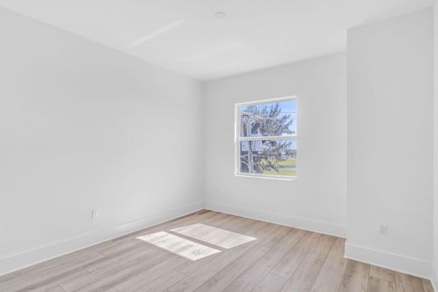 unfurnished room featuring light hardwood / wood-style floors