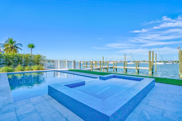 view of swimming pool featuring a water view