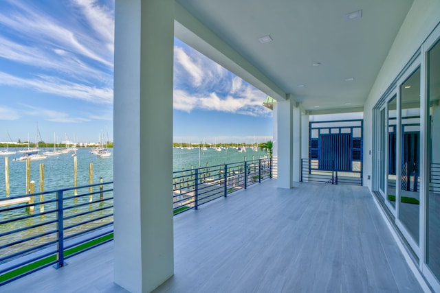 wooden deck with a water view