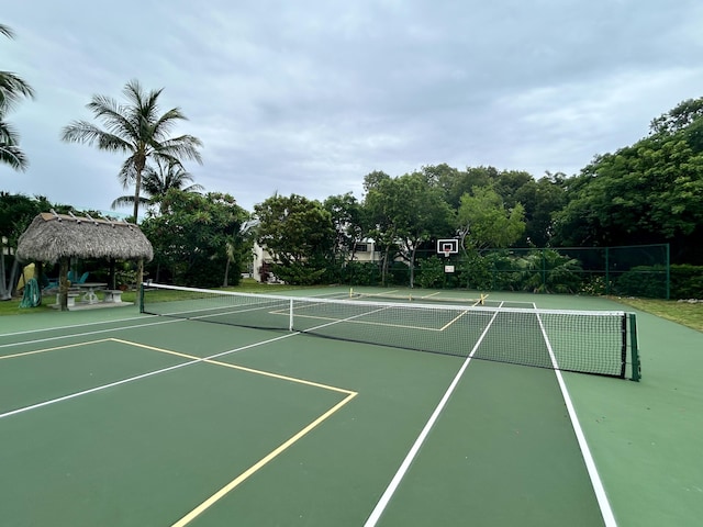 view of tennis court featuring a gazebo