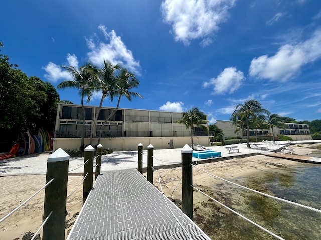 view of dock with a pool