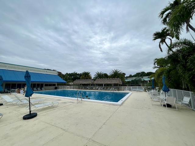 view of swimming pool with a patio