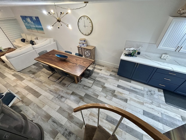 dining space featuring a chandelier and light hardwood / wood-style flooring