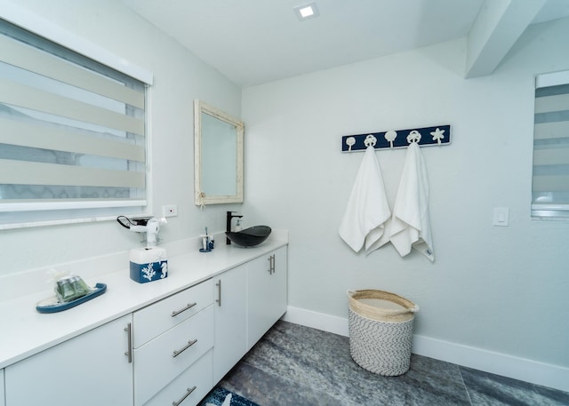 25 N Blackwater Ln, Key Largo, FL 33037 - bathroom featuring baseboards and double vanity