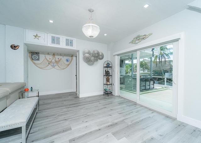 25 N Blackwater Ln, Key Largo, FL 33037 - living area featuring light wood-style flooring, baseboards, recessed lighting, and a chandelier