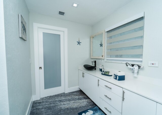 25 N Blackwater Ln, Key Largo, FL 33037 - bathroom with vanity and baseboards