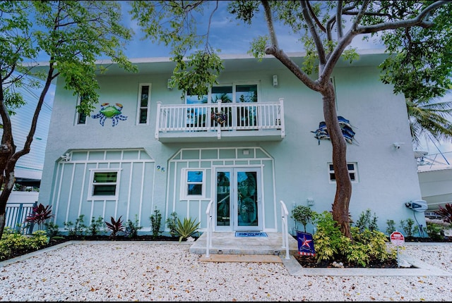 25 N Blackwater Ln, Key Largo, FL 33037 - rear view of property with a balcony and stucco siding