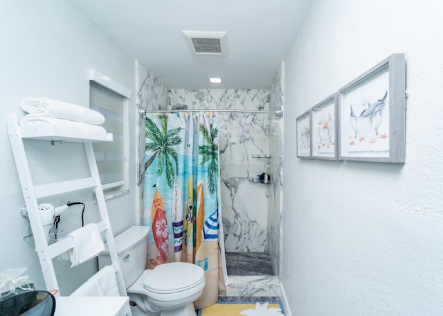 25 N Blackwater Ln, Key Largo, FL 33037 - bathroom with a marble finish shower, toilet, and vanity