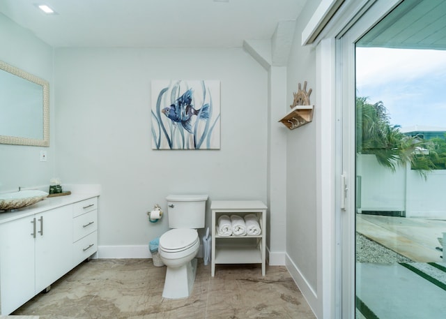 25 N Blackwater Ln, Key Largo, FL 33037 - bathroom featuring vanity, baseboards, and toilet