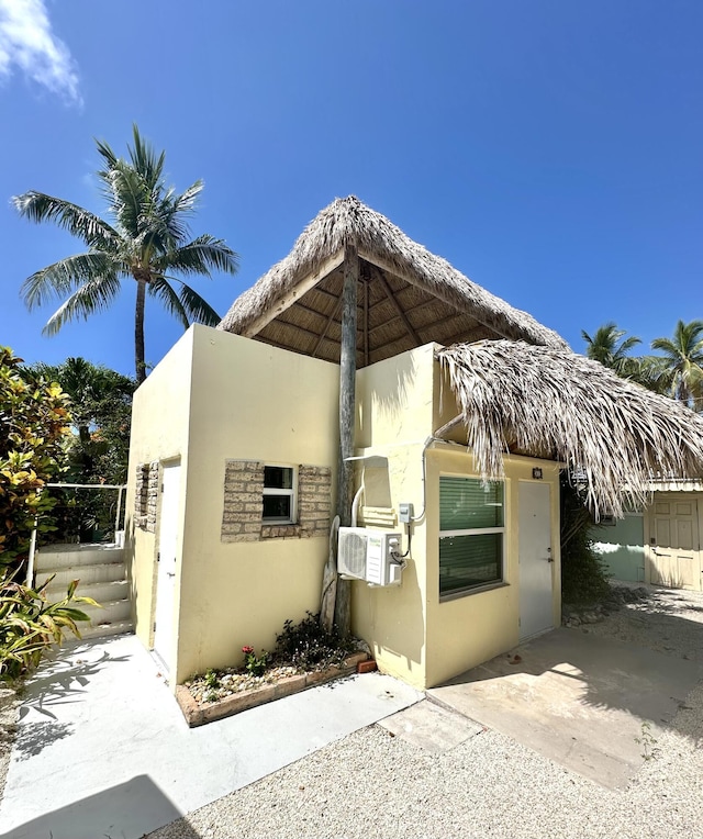 view of side of property featuring cooling unit