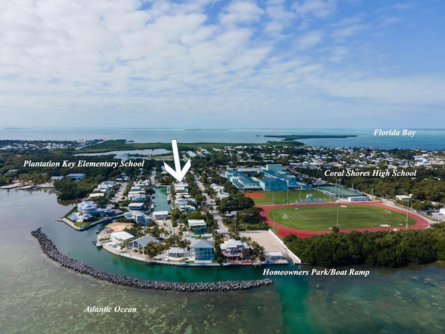 birds eye view of property featuring a water view