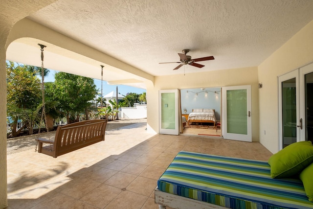 view of patio featuring an outdoor living space and ceiling fan