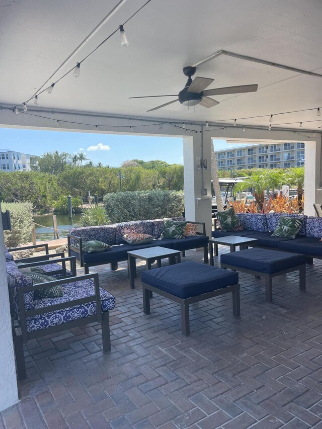 500 Burton Dr Unit 3406, Tavernier, FL 33070 - view of patio / terrace featuring an outdoor hangout area, a ceiling fan, and a water view