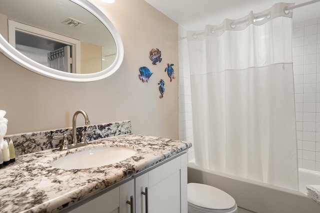 full bathroom with vanity, toilet, and shower / bath combo